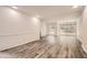 Open-concept living space featuring wood-look floors and large windows at 2459 Cedar Canyon Se Ct, Marietta, GA 30067