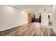 Bright, open-concept space with wood-look floors connecting the living area and kitchen at 2459 Cedar Canyon Se Ct, Marietta, GA 30067