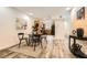 Modern living room and kitchen area featuring hardwood floors, modern decor, and recessed lighting at 2459 Cedar Canyon Se Ct, Marietta, GA 30067