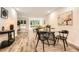 Open-concept living room featuring hardwood floors, large windows, and stylish modern decor at 2459 Cedar Canyon Se Ct, Marietta, GA 30067