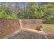 Private outdoor patio area enclosed by a brick wall, perfect for relaxing and entertaining at 2459 Cedar Canyon Se Ct, Marietta, GA 30067