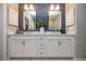 Modern bathroom features dual vanities, stylish lighting, and blue-tiled accent wall at 371 Grant Cir # 1812, Atlanta, GA 30315