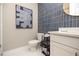 Stylish bathroom with a modern toilet and a large abstract art piece hung on the wall at 371 Grant Cir # 1812, Atlanta, GA 30315