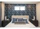 Comfortable bedroom with patterned wallpaper, providing a cozy and modern feel at 371 Grant Cir # 1812, Atlanta, GA 30315