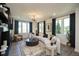 Bright living room with large windows, wood floors, and a contemporary media center at 371 Grant Cir # 1812, Atlanta, GA 30315