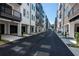 Street view of modern townhomes with black asphalt and manicured landscaping at 371 Grant Cir # 1812, Atlanta, GA 30315