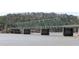 View of a long steel bridge spanning across water with forest in the background at 403 Newland Way, Acworth, GA 30102