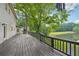 Large back deck overlooking the lake, perfect for outdoor entertaining and relaxation at 177 Coopers Pond Dr, Lawrenceville, GA 30044