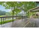 Enjoy lake views from this spacious back deck with wood flooring and railing at 177 Coopers Pond Dr, Lawrenceville, GA 30044