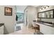 Spacious bathroom with double sink vanity, tile floor, and separate tub and shower at 177 Coopers Pond Dr, Lawrenceville, GA 30044
