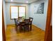 Bright dining room with wood floors, modern light fixture, and zebra artwork at 2234 Clifton Springs Mnr, Decatur, GA 30034