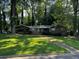 Charming single-story home with well-maintained lawn and mature trees at 2234 Clifton Springs Mnr, Decatur, GA 30034