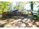 Exterior elevation of a house with patio, with a car parked at the side at 2234 Clifton Springs Mnr, Decatur, GA 30034