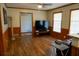 Cozy living room featuring a mounted television and hardwood flooring at 2234 Clifton Springs Mnr, Decatur, GA 30034