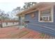 Exterior view of a spacious back deck with siding, a window AC unit, and a sliding glass door, perfect for relaxation at 32 Hillcrest Drive Southeast Se Dr, Austell, GA 30168