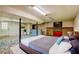 Finished basement with colorful mosaic floor, white brick walls, tv, and drop ceiling, great for entertaining at 32 Hillcrest Drive Southeast Se Dr, Austell, GA 30168