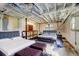 Finished basement featuring two beds, exposed duct work, and painted ceilings, creating a modern and spacious feel at 32 Hillcrest Drive Southeast Se Dr, Austell, GA 30168