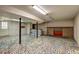 Unfinished basement with decorative tiling, featuring a bar area and brick accent wall at 32 Hillcrest Drive Southeast Se Dr, Austell, GA 30168
