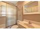 Bathroom features a shower-tub combo with sliding glass doors, toilet, vanity, and mirror at 32 Hillcrest Drive Southeast Se Dr, Austell, GA 30168