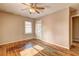 Bedroom with hardwood floors, ceiling fan, and natural light at 32 Hillcrest Drive Southeast Se Dr, Austell, GA 30168