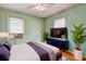 Bedroom boasts hardwood floors, large windows, and a dresser, blending comfort with style at 32 Hillcrest Drive Southeast Se Dr, Austell, GA 30168