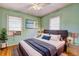 Stylish bedroom with modern decor, featuring a queen bed, large windows, and sleek furnishings at 32 Hillcrest Drive Southeast Se Dr, Austell, GA 30168