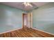 Bedroom with neutral walls, hardwood floors, and a doorway and closet, creating a simple, inviting space at 32 Hillcrest Drive Southeast Se Dr, Austell, GA 30168