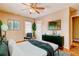 Stylish bedroom featuring hardwood floors, ceiling fan and a dresser at 32 Hillcrest Drive Southeast Se Dr, Austell, GA 30168