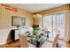 Dining room with modern light fixture next to sliding glass doors to deck at 32 Hillcrest Drive Southeast Se Dr, Austell, GA 30168