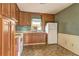 Efficient kitchen layout with wooden cabinets, white appliances, and functional design at 32 Hillcrest Drive Southeast Se Dr, Austell, GA 30168