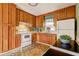 Traditional kitchen with wooden cabinets, white appliances, and ample counter space at 32 Hillcrest Drive Southeast Se Dr, Austell, GA 30168
