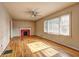 Sun-filled living room with hardwood floors, a fireplace, and large windows with blinds at 32 Hillcrest Drive Southeast Se Dr, Austell, GA 30168