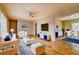 Well-lit living room with hardwood floors, a fireplace, and seamlessly integrated dining area at 32 Hillcrest Drive Southeast Se Dr, Austell, GA 30168
