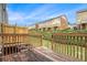 View from deck showing backyard and neighboring townhome exteriors under blue sky at 801 Tulip Poplar Way # 2501, Lawrenceville, GA 30044