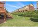 The townhome's backyard featuring wooden decks and lush greenery at 801 Tulip Poplar Way # 2501, Lawrenceville, GA 30044