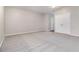 Spacious bedroom with neutral walls, plush carpet, a closet, and ample room for furnishings at 801 Tulip Poplar Way # 2501, Lawrenceville, GA 30044
