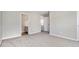 Spacious bedroom featuring neutral paint, grey carpet, and entry to walk-in closet at 801 Tulip Poplar Way # 2501, Lawrenceville, GA 30044
