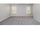 Bright bedroom with neutral walls, plush carpeting, and large windows providing natural light at 801 Tulip Poplar Way # 2501, Lawrenceville, GA 30044