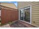 Exterior view of wooden deck with fence and sliding glass door to home at 801 Tulip Poplar Way # 2501, Lawrenceville, GA 30044