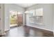 Bright dining area with sliding glass doors leading to an outdoor deck and dark wood-look floors at 801 Tulip Poplar Way # 2501, Lawrenceville, GA 30044