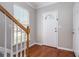 Foyer with hardwood floors and stairway; features front door with decorative glass at 801 Tulip Poplar Way # 2501, Lawrenceville, GA 30044