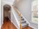 Light-filled entryway featuring hardwood floors, staircase with carpet, and neutral paint at 801 Tulip Poplar Way # 2501, Lawrenceville, GA 30044