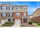 Charming townhome with brick and siding, featuring a well-maintained lawn and attached garage at 801 Tulip Poplar Way # 2501, Lawrenceville, GA 30044