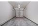 Empty, two car garage with painted walls and concrete floor at 801 Tulip Poplar Way # 2501, Lawrenceville, GA 30044