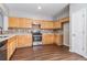 Spacious kitchen featuring stainless steel appliances, light wood cabinets, and modern fixtures at 801 Tulip Poplar Way # 2501, Lawrenceville, GA 30044
