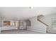 Open-concept living space with staircase and view to kitchen through arched opening at 801 Tulip Poplar Way # 2501, Lawrenceville, GA 30044