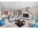 Spacious, neutrally decorated living room with ample seating and open floor plan at 801 Tulip Poplar Way # 2501, Lawrenceville, GA 30044