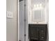 Contemporary powder room with black vanity and framed mirror at 801 Tulip Poplar Way # 2501, Lawrenceville, GA 30044