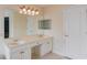 Bright bathroom features a double sink vanity, large mirror, and neutral color palette at 805 River Valley Dr, Dacula, GA 30019