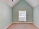 Bedroom with a high ceiling and window with a view to the backyard at 805 River Valley Dr, Dacula, GA 30019